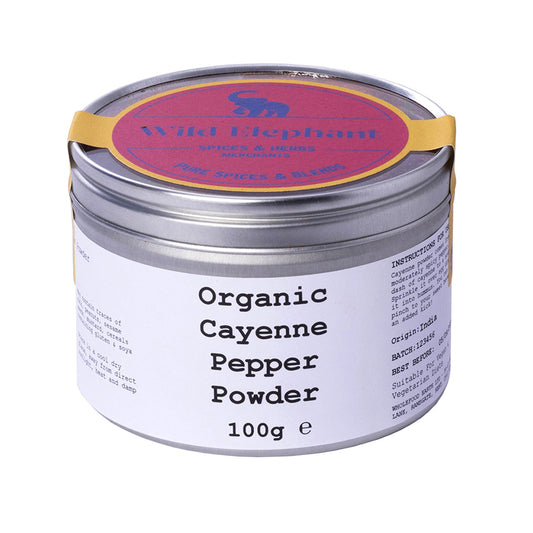 Organic cayenne pepper powder from Wild Elephant, shown in a clear container with vibrant red spice, part of Whole Food Earth herbs and spices.