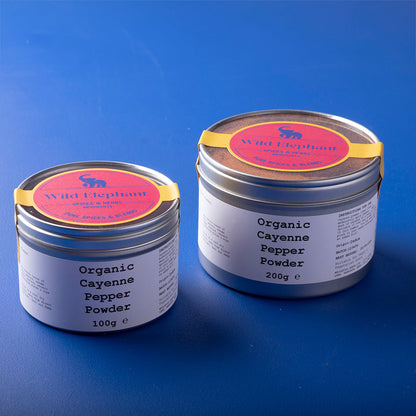 Organic cayenne pepper powder from Wild Elephant, a vibrant red spice in a clear container, perfect for herbs and spices cooking.