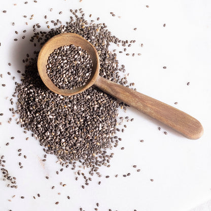Organic chia seeds from Whole Food Earth, small black seeds in a clear jar, high in fiber and omega-3.