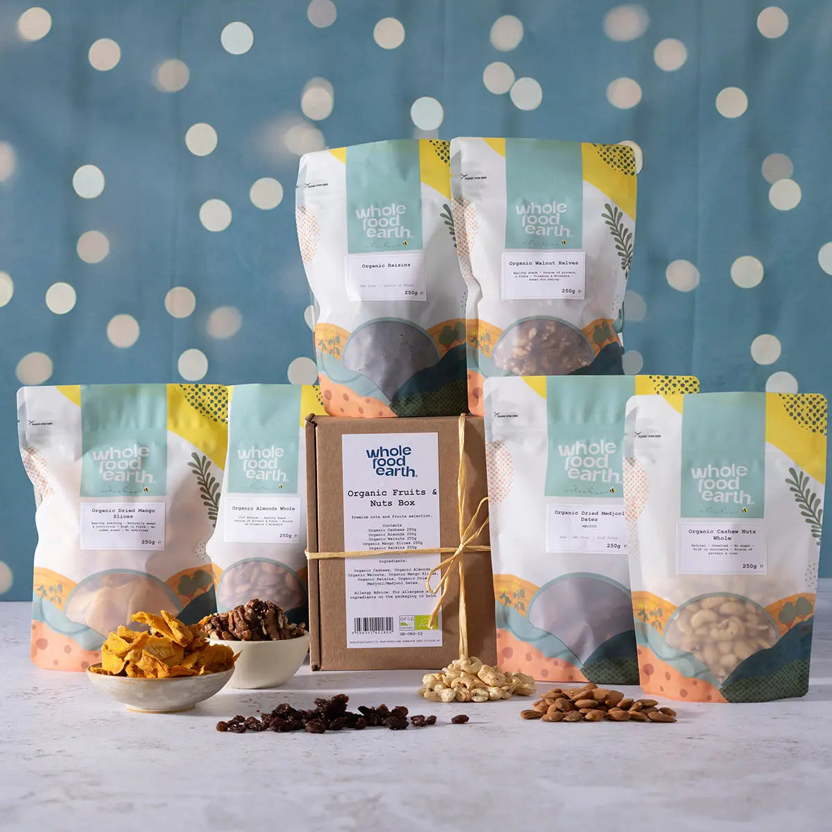 Organic Christmas fruits and nuts box by Whole Food Earth, featuring a variety of fresh nuts, seeds, and dried fruits.