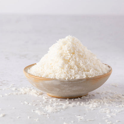 Organic coconut desiccated from Whole Food Earth, showing shredded dried coconut suitable for baking and cooking.