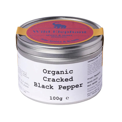 Organic cracked black pepper from Wild Elephant, whole black pepper spice for cooking, by Whole Food Earth, close-up of spice grains.