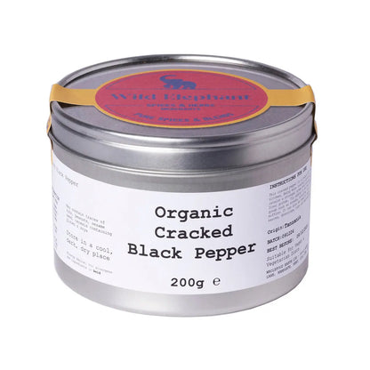 Organic cracked black pepper from Wild Elephant, whole black peppercorns in a natural herb and spice product image.