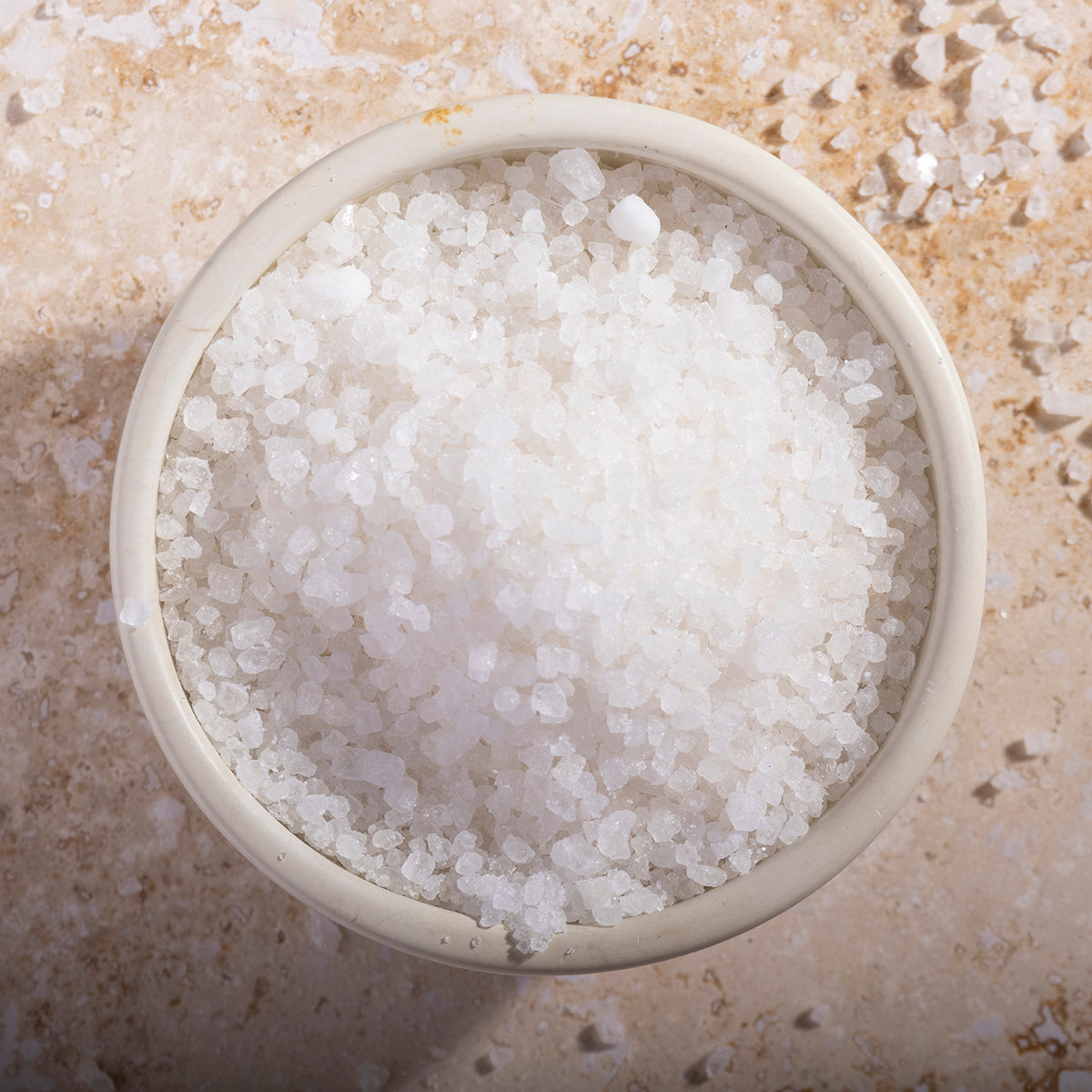 Organic Dead Sea salts from Whole Food Earth, showing coarse mineral crystals used for baths and skincare.