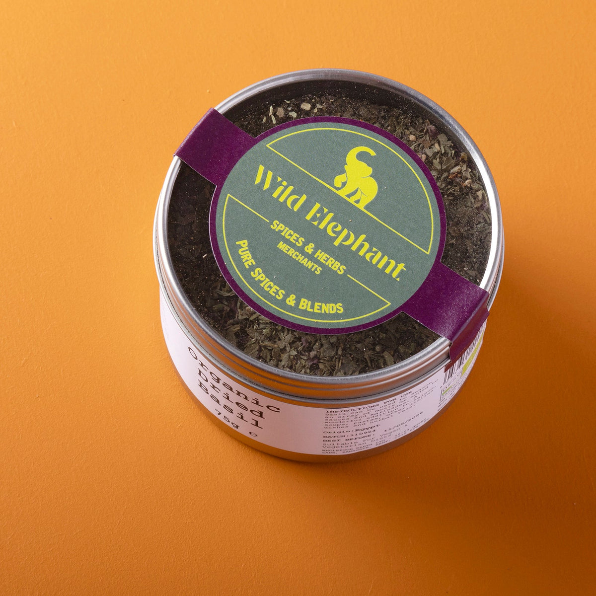 Organic dried basil from Whole Food Earth, wild-harvested herbs in a 75g package, showcasing dried basil leaves.