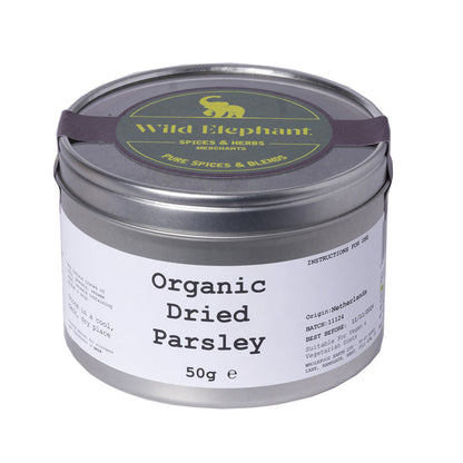 Organic dried parsley from Wild Elephant displayed in a clear jar, showing vibrant green, dried herb leaves for herbs and spices.