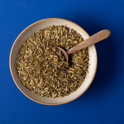 Organic fennel seeds from Whole Food Earth, showcasing a close-up of vibrant, aromatic fennel seeds in a clear container.