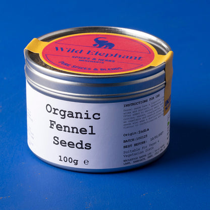 Whole Food Earth organic fennel seeds in a clear jar, showcasing small, greenish-brown seeds used as herbs and spices.