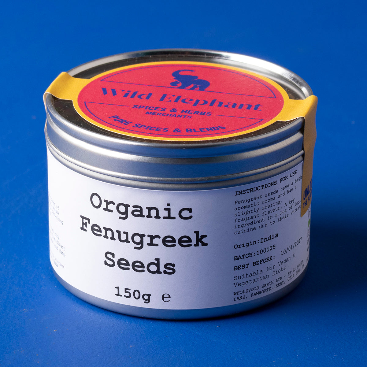 Organic fenugreek seeds from Wild Elephant, 150g, showing small, golden-brown spice seeds in a clear container.