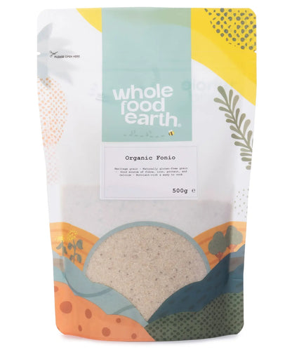 Organic Whole Food Earth Fonio grains in a clear container, showcasing small, light-colored cereal grains on a white background.