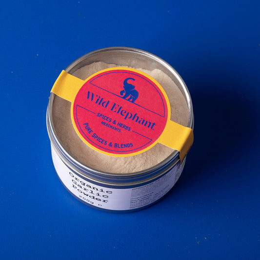 Organic garlic powder by Whole Food Earth in a 200g package, showcasing a jar of finely ground garlic spice.