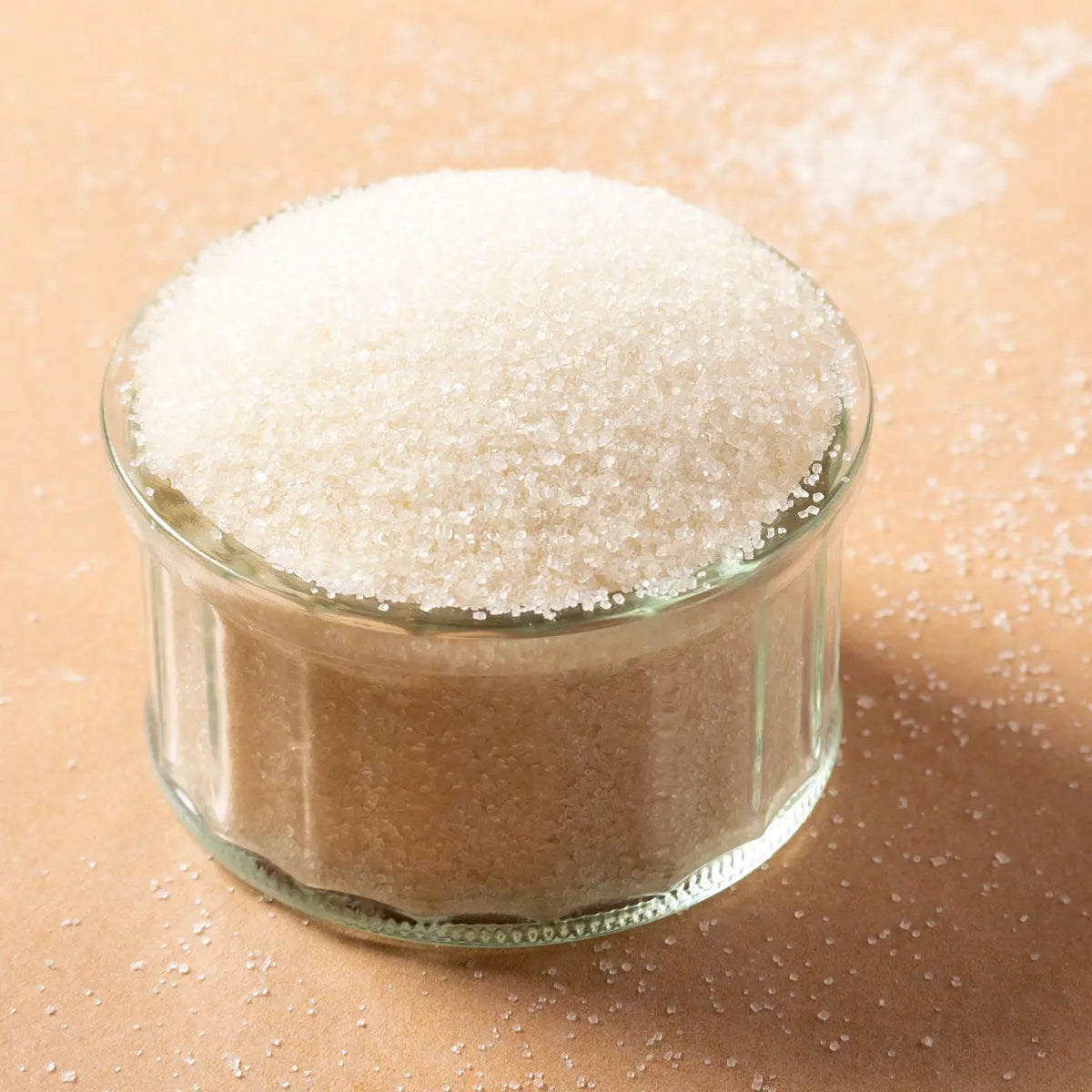 Organic golden cane sugar from Whole Food Earth, showing granulated natural sweetener with golden color and crystalline texture.