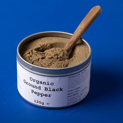 Organic Ground Black Pepper from Wild Elephant, Whole Food Earth herbs and spices, close-up of dark ground black pepper in jar