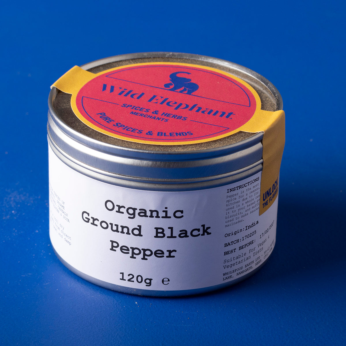 Organic ground black pepper from Wild Elephant, a Whole Food Earth herb and spice, shown in a clear container.