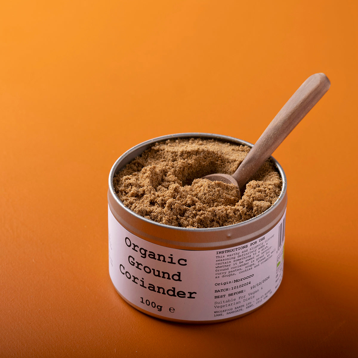 Organic ground coriander from Wild Elephant, a 100g package of fresh herbs and spices with a textured surface and labeled packaging.