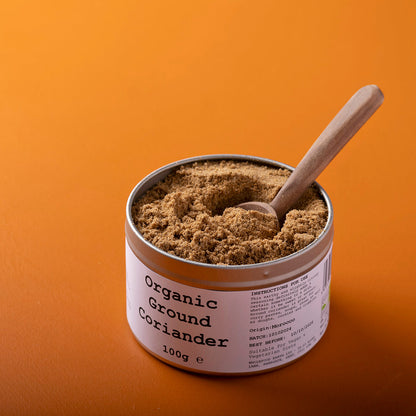Organic ground coriander from Wild Elephant, a 100g package of fresh herbs and spices with a textured surface and labeled packaging.
