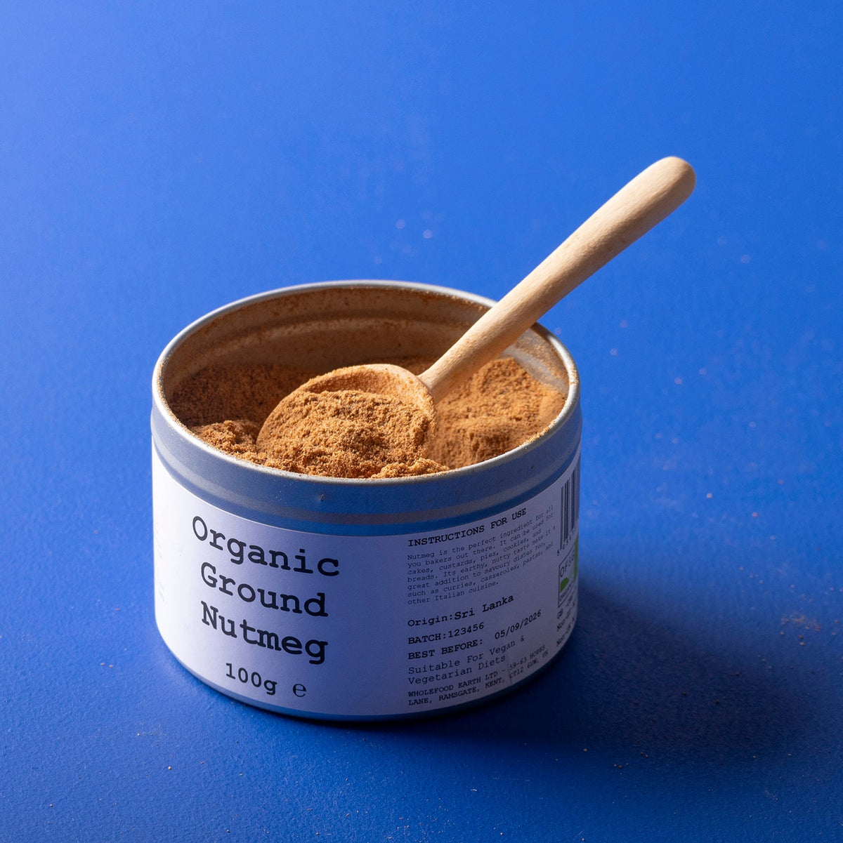 Organic ground nutmeg from Wild Elephant in a 100g package, showing the spice's warm brown powder in a clear jar.