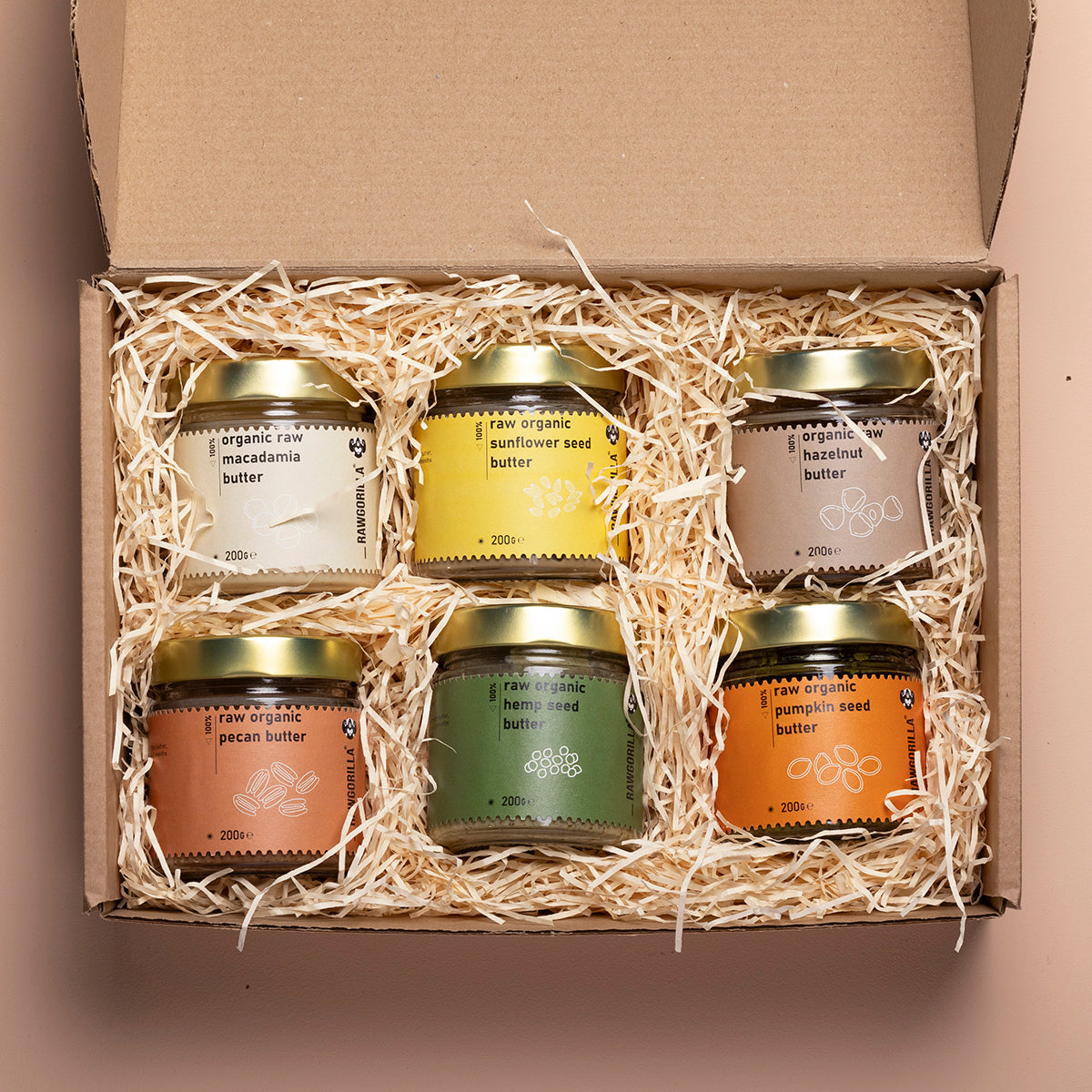 Assorted organic nut and seed butters in the Whole Food Earth selection box, featuring creamy and crunchy textures.