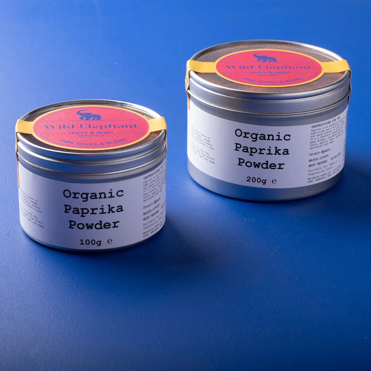Organic paprika powder from Whole Food Earth, a vibrant red herb and spice in a clear jar, perfect for seasoning dishes.