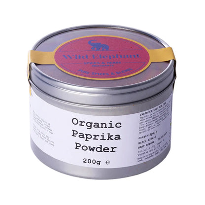 Organic paprika powder from Whole Food Earth, vibrant red spice in a clear jar, herbal herbs and spices product for cooking.