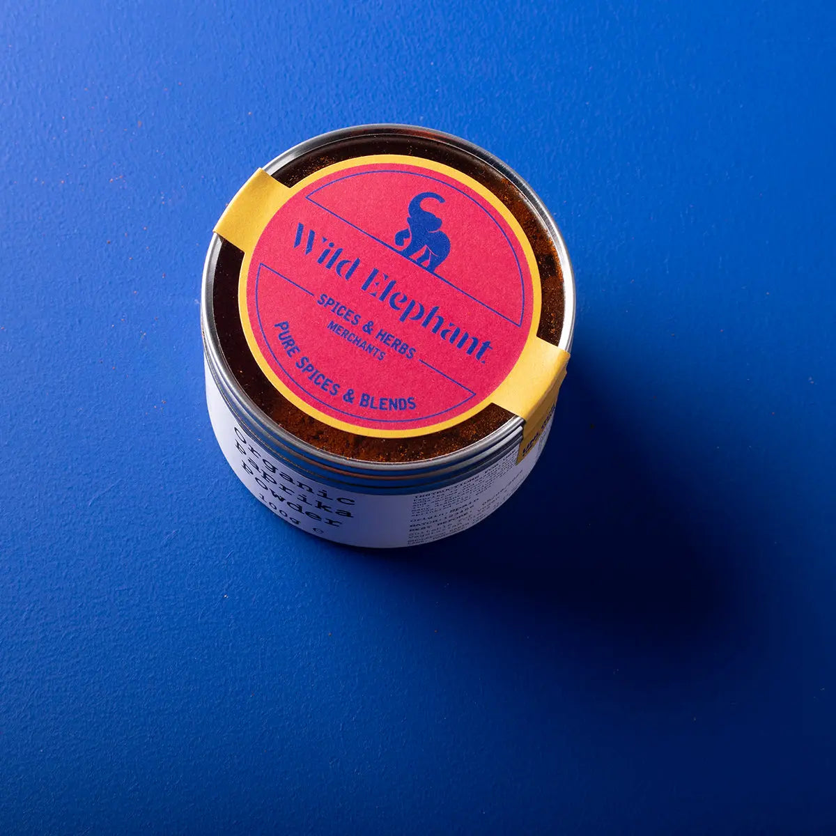 Organic paprika powder from Whole Food Earth, a vibrant red herbs and spices in a clear jar, perfect for seasoning dishes.