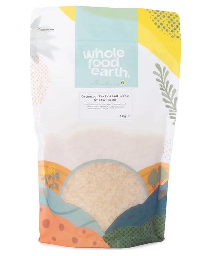 Whole Food Earth organic parboiled long white rice grains, 1kg package, showcasing polished, elongated rice kernels on a white background.