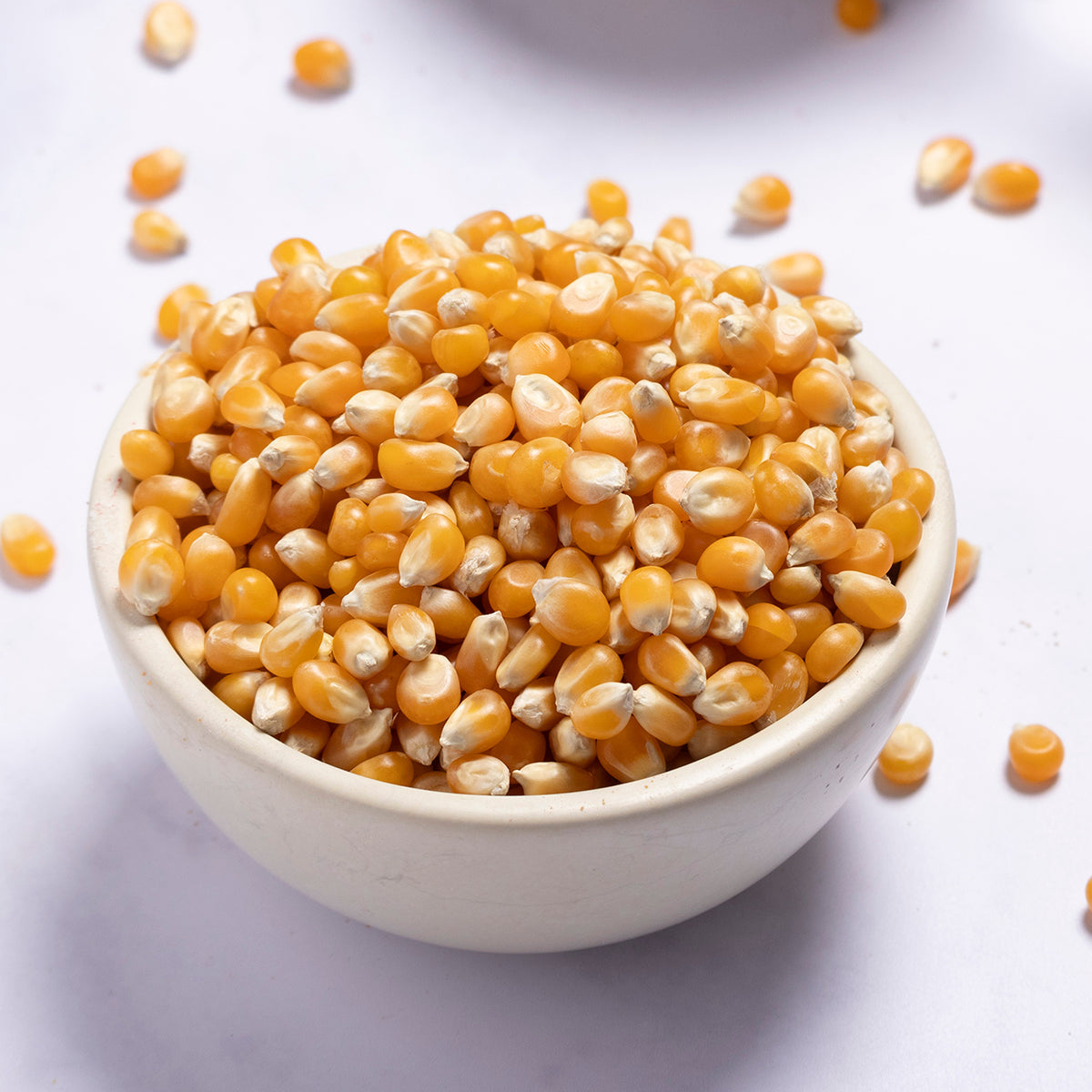 Organic popcorn grains from Whole Food Earth, showcasing fresh, whole organic popcorn kernels on a neutral background.