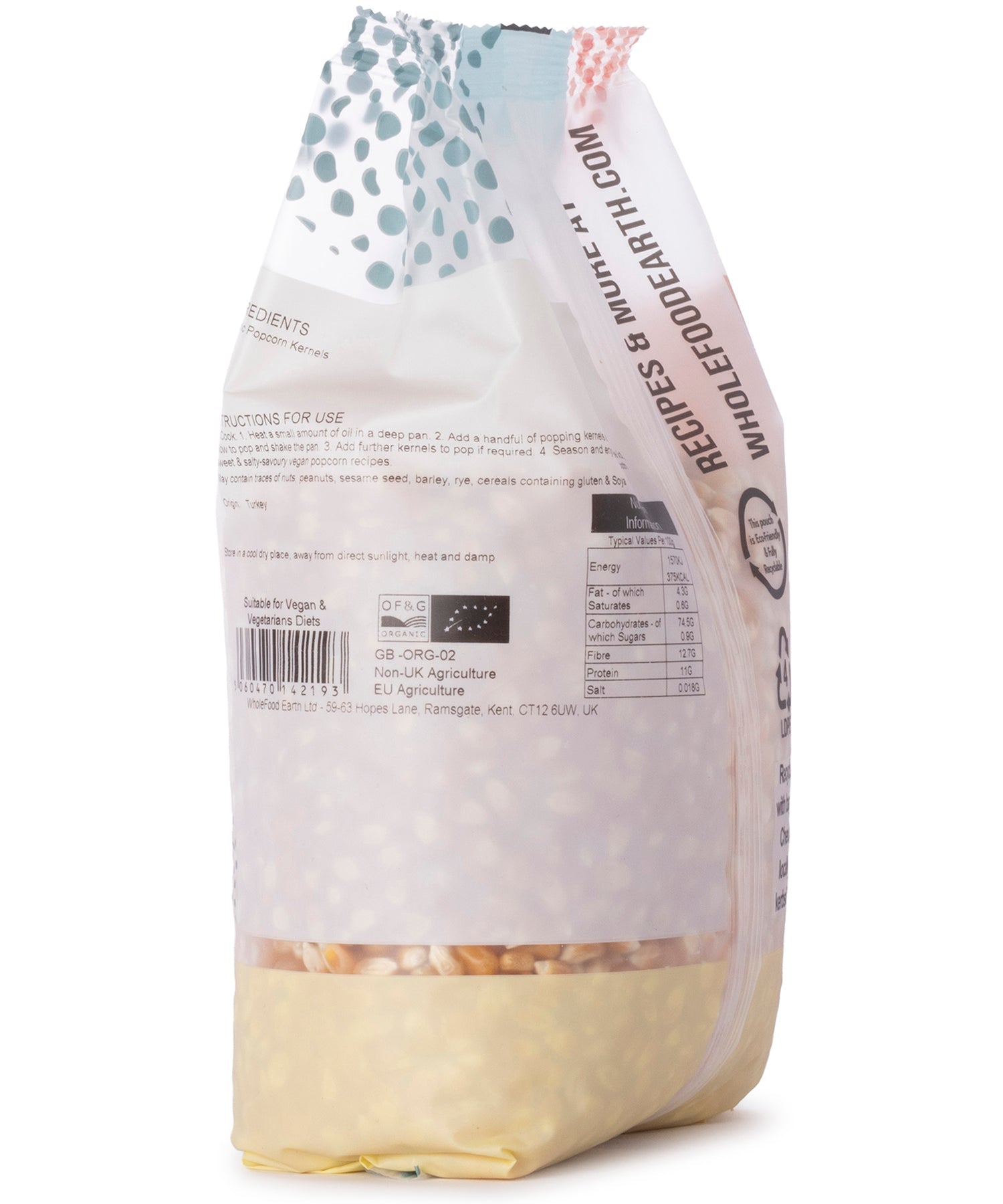 Organic popcorn in a 1kg bag from Whole Food Earth, displayed on a wooden surface with scattered popcorn kernels.