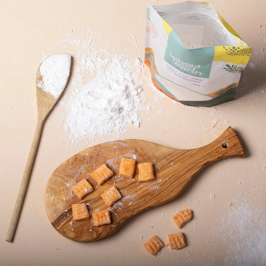 Organic potato starch in a natural kitchen setting, showing a bag of Whole Food Earth organic flour on a wooden surface.
