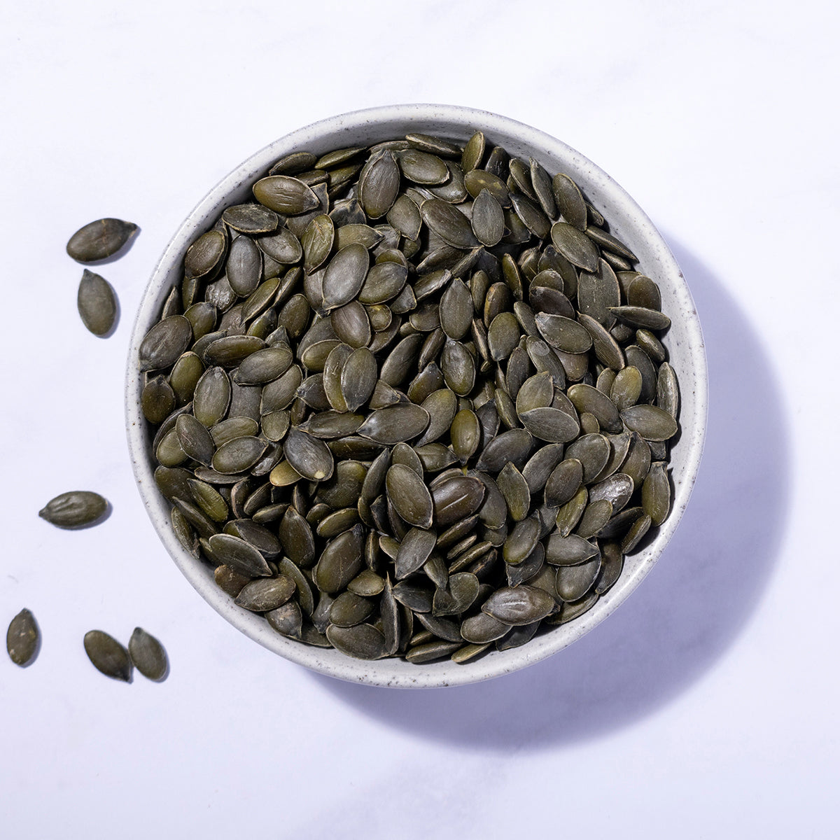 Organic Pumpkin Seeds from Whole Food Earth, showing fresh, raw pumpkin seeds in a close-up view.