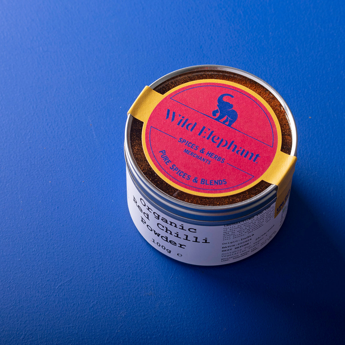 Organic red chili powder from Wild Elephant in a 100g package, showing vibrant red chili spice in a natural herbs and spices product.