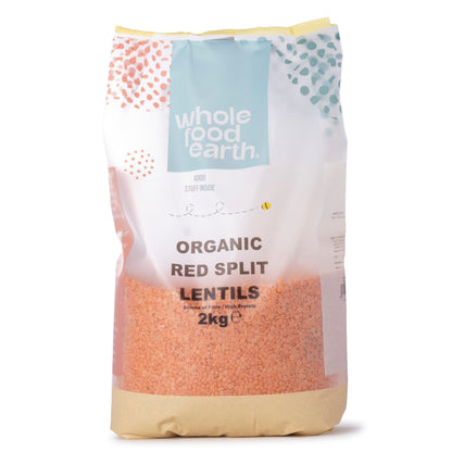 Organic red split lentils from Whole Food Earth, displayed in a clear bag, showing vibrant orange-red pulses suitable for cooking.