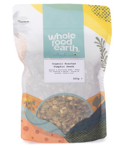 Organic roasted pumpkin seeds from Whole Food Earth, showing a close-up of crunchy, golden pumpkin seeds in a 500g package.