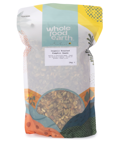 Organic roasted pumpkin seeds from Whole Food Earth, showing a close-up of lightly seasoned, crunchy pumpkin seeds in a 1kg package.
