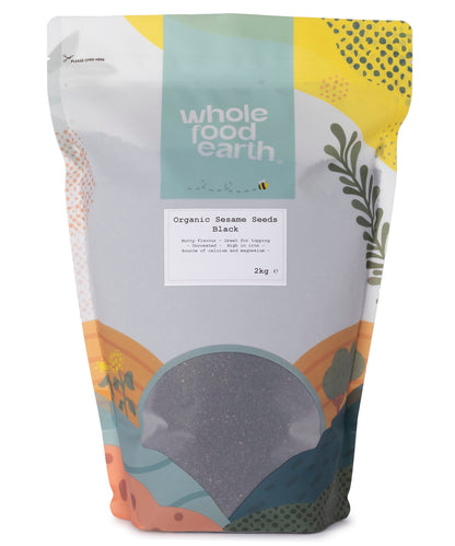 Black organic sesame seeds from Whole Food Earth in a 2kg bag, shown in a close-up image highlighting their small, textured seeds.