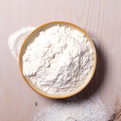 Organic sugar cane powder from Whole Food Earth, showing a close-up of the natural, granulated sweetener in a glass jar.