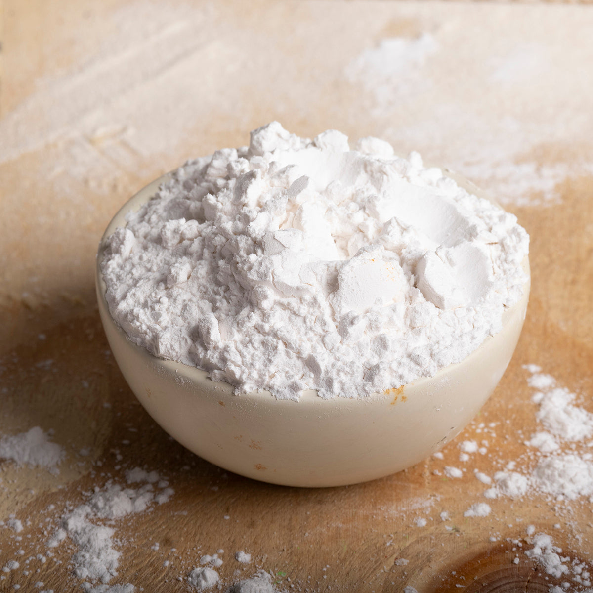 Organic tapioca starch in a clear bowl, showing fine white powder, from Whole Food Earth, used as a gluten-free flour alternative.