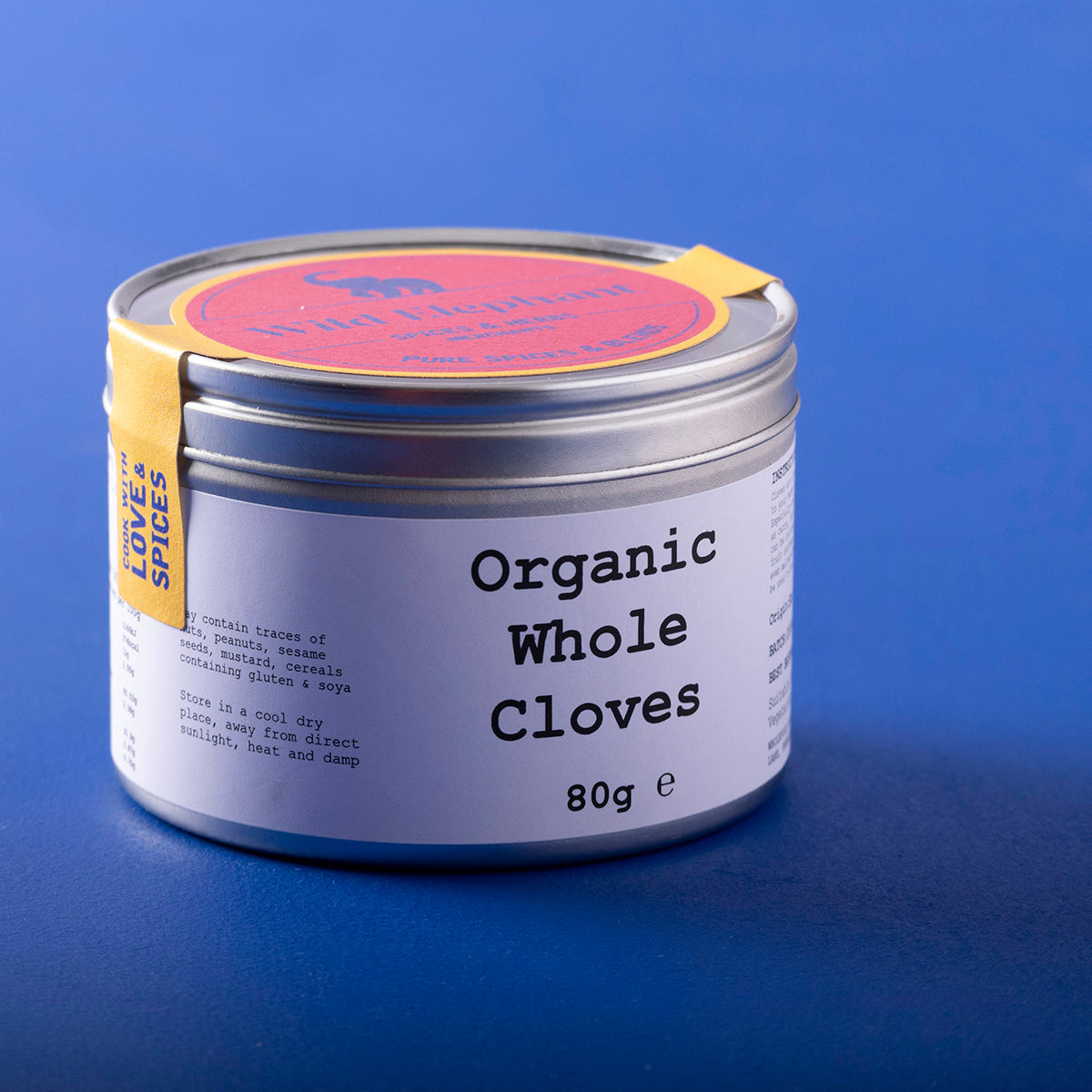 Organic Whole Cloves from Wild Elephant, 80g, in a clear jar, showcasing dark, aromatic spice used for cooking and baking.