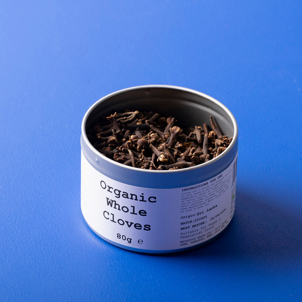 Organic Whole Cloves from Wild Elephant, 80g, in a clear jar showing dark brown aromatic whole spices.