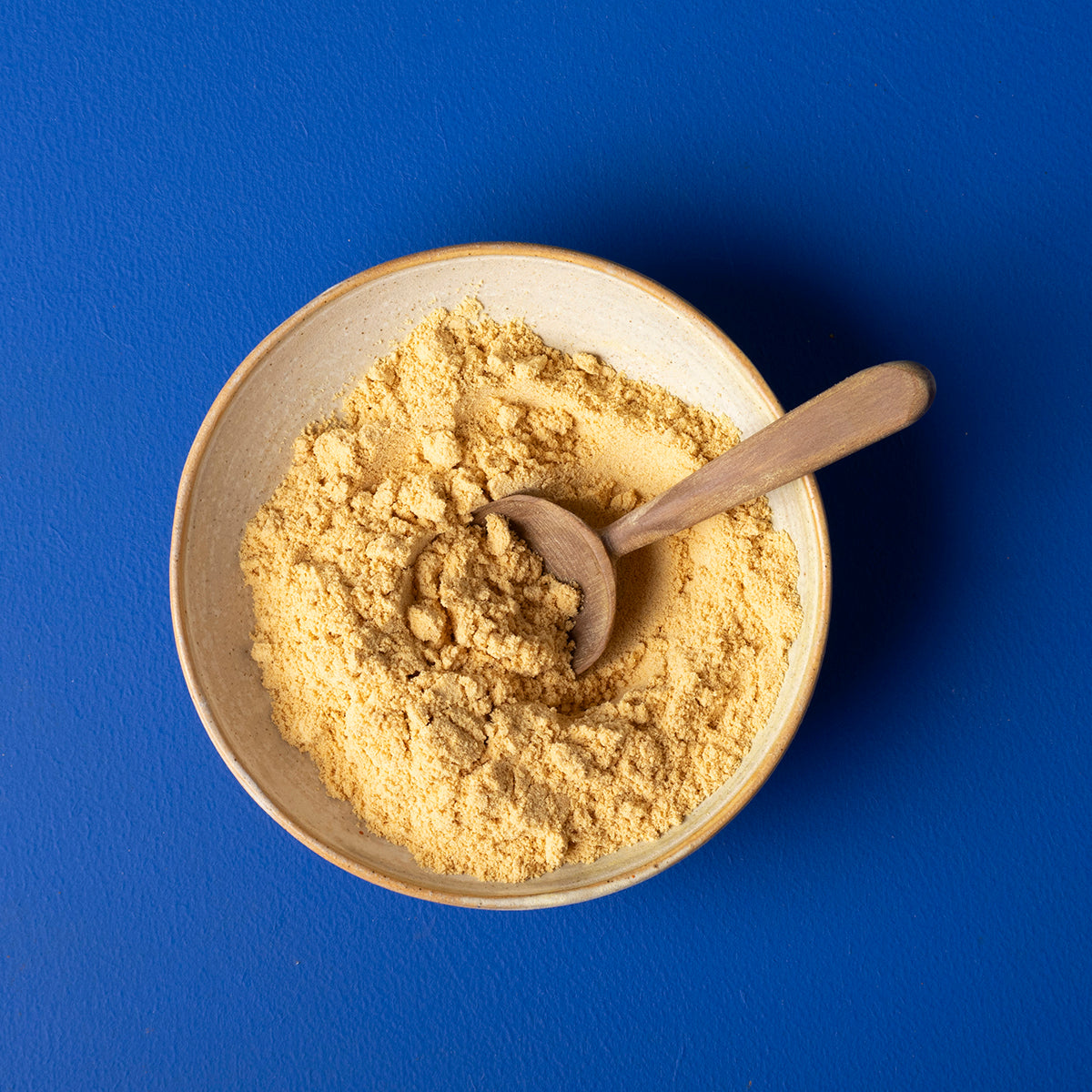 Organic yellow mustard powder from Whole Food Earth, 150g, in a clear jar with a bright yellow spice powder inside.