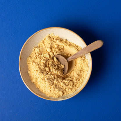 Organic yellow mustard powder from Whole Food Earth, 150g, in a clear jar with a bright yellow spice powder inside.