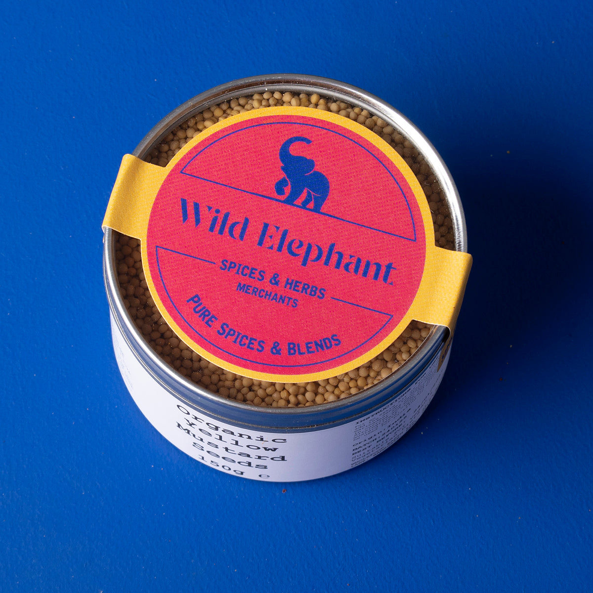 Organic yellow mustard seeds from Wild Elephant in a 150g package, showing small yellow seeds in a clear container.