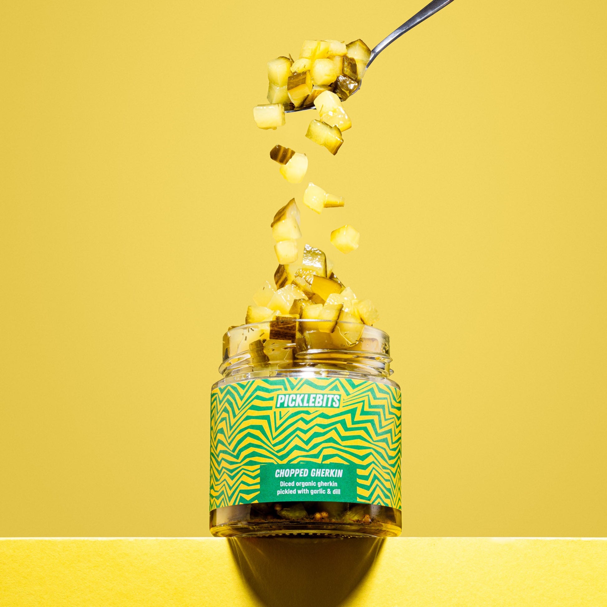 Organic chopped dill pickles in a jar, featuring fresh organic gherkin dill pickles by PICKLEBITS.