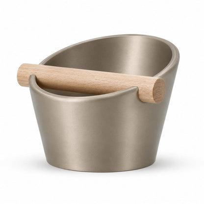 KNOCDIC® oval coffee knock box with metallic gold finish and real oak wood bar for espresso machine tamping.