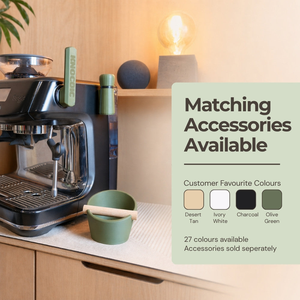 KNOCDIC® WDT tool with magnetic holder, shown with matching colorful oval knockbox in a professional coffee setup.