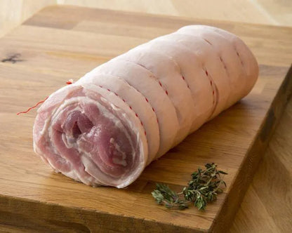 Boneless pork belly joint from Primrose Herd, showcasing fresh, well-trimmed pork belly with a pink hue and smooth fat layer.