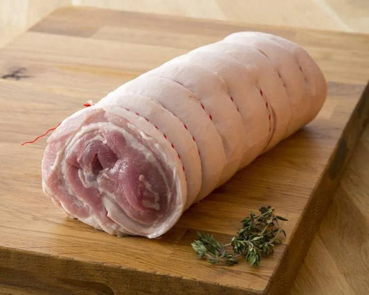 Boneless pork belly joint from Primrose Herd, showcasing fresh, skinless pork belly for roasting or roasting dishes.