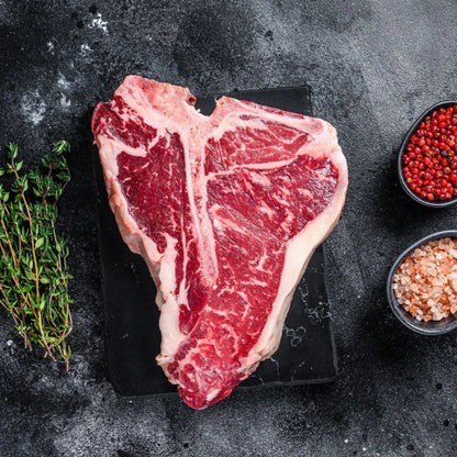 Prime Primrose Herd dry-aged beef T-bone steak, 500g, showing marbled beef with bone-in cut and rich texture.