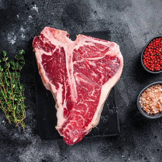 Prime Primrose Herd dry-aged beef T-bone steak, 500g, showing marbled beef with bone-in cut and rich texture.