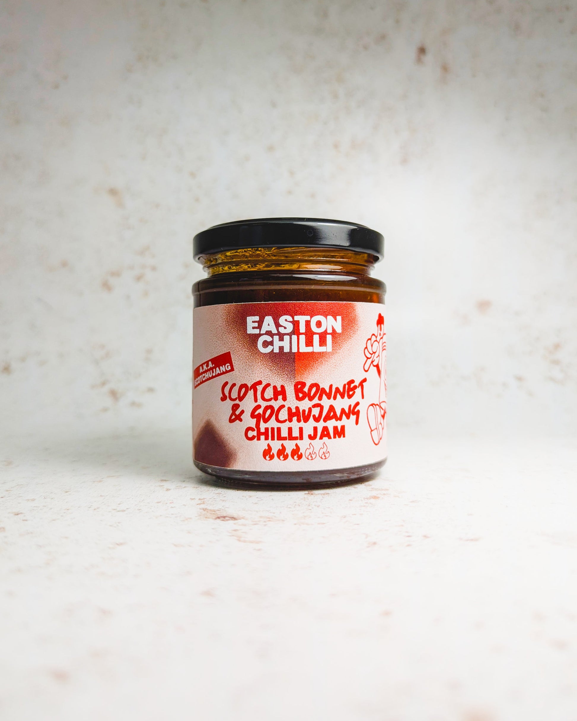 Easton Chilli Scotch Bonnet and Gochujang Chilli Jam jar with vibrant red chili jam visible inside.